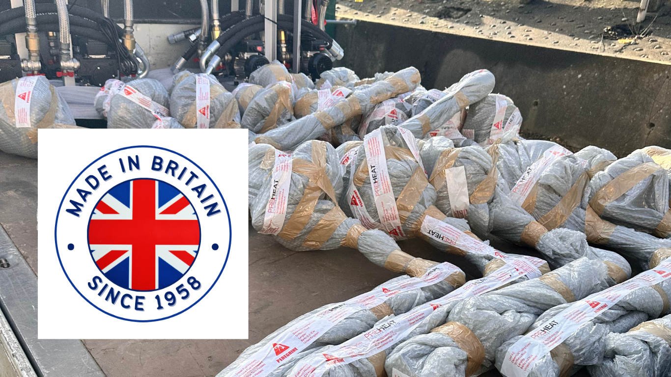 Diesel fuel tank heaters wrapped and loaded on a flat bed lorry with the logo made in Britain since 1958.