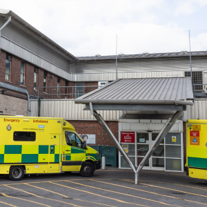 Photo of two ambulances outside an A&E unit at a hospital.