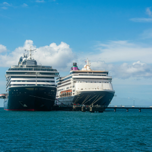 Photo of two big cruise liners on the sea.