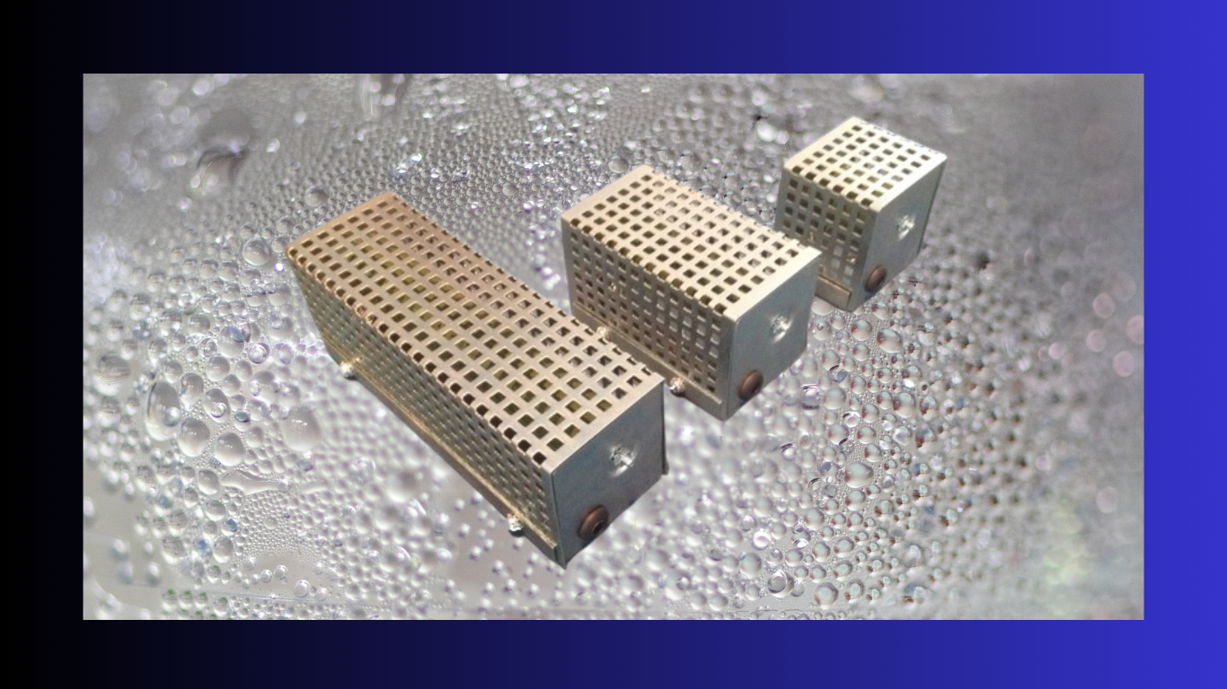 Image of three of Preheat's Anti Condensation heaters on a background of water condensation behind them.