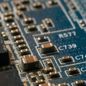 Image of a circuit board with corrosion and rust on the chips.