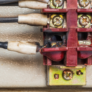 Image of a burnt out connection on an electrical board.