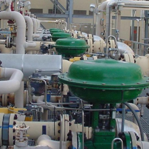 PAD Heaters for Control valves Image of several green control valves on industrial equipment.
