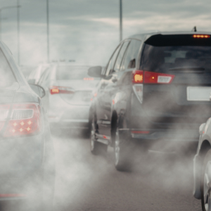 Image of several cars with exhaust emissions.