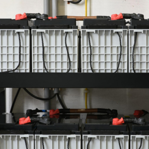 PAD Heaters for Several batteries Images of industrial batteries on 2 shelves.