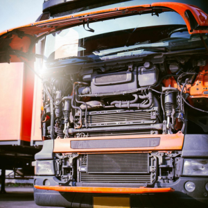 PAD Heaters for Truck engine Image of a large red truck with it's bonnet open showing the engine.