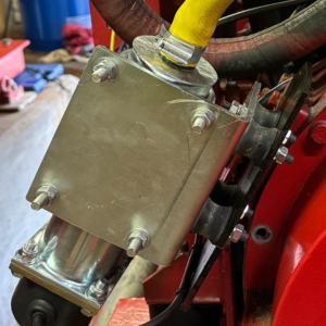 A close up image of a Peregrine Fire Pump Heater showing the fitting plate to hold it in place.