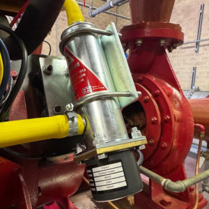 A close up image of a Peregrine Fire Pump Heater showing it securing it in place.
