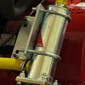 A close up image of a Peregrine Fire Pump Heater showing the brackets securing it in place.