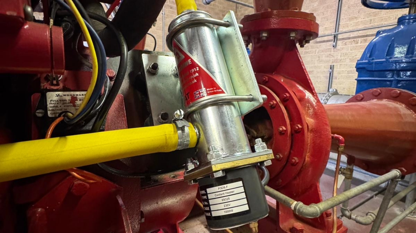 A close up image of a Preheat Peregrine Fire Pump Heater on a customers Fire pump engine.